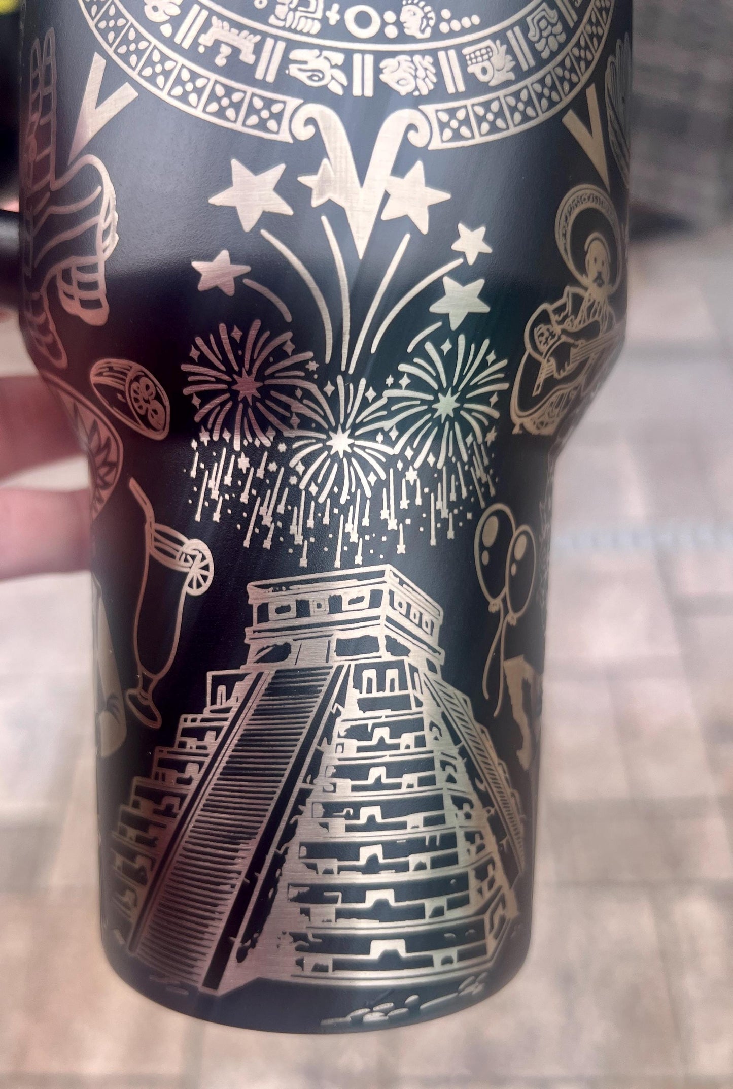 Close-up of Mayan temple and fireworks engraving from a Mexican heritage wrap on a Black Stanley 40oz Quencher H2.0